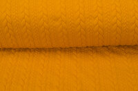 Strickstoff mit Zopfmuster ockergelb