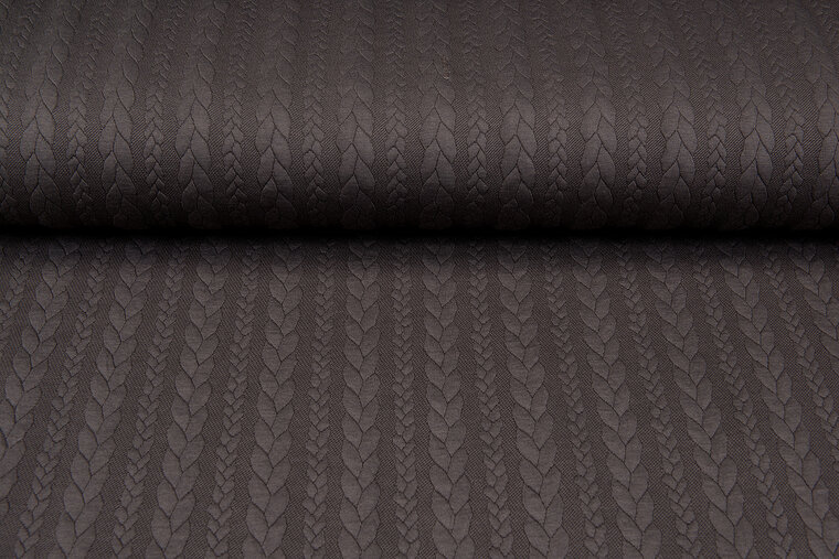 Strickstoff mit Zopfmuster braun
