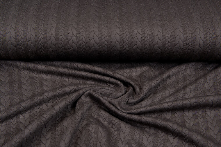 Strickstoff mit Zopfmuster braun